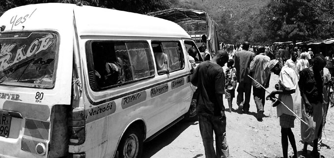 A matatu loading passengers in Kenya. Photo by flickr user Rick MN. November 24, 2008.